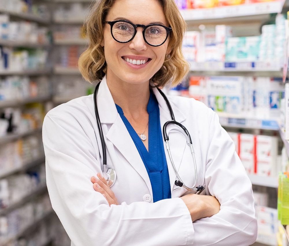 happy-smiling-pharmacist-in-drugstore-C9R8PCC.jpg